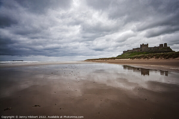 Bamburgh Castle taken from the beach on a stormy day Picture Board by Jenny Hibbert