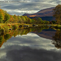 Buy canvas prints of Reflections of Ben Nevis in the Caledonian canal, Corpach by Jenny Hibbert