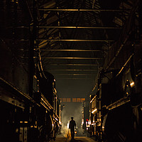 Buy canvas prints of Worker in loco shed  by Jenny Hibbert