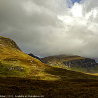 Buy canvas prints of Old Man of Storr in the distance by Jenny Hibbert