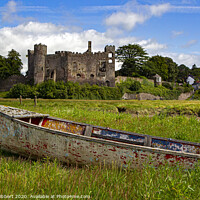 Buy canvas prints of Laugharne Castle with an abandoned boat in the foreground by Jenny Hibbert