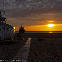Buy canvas prints of Three old boats on Dungeness beach as dawn rises by Jenny Hibbert