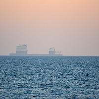 Buy canvas prints of Boskalis ship in the horizon of a sunset by Susan Ireland