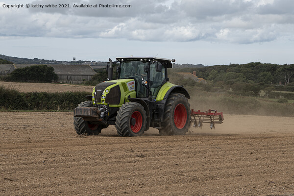 Tractor  in a Cornish field Picture Board by kathy white