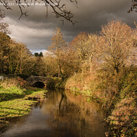 Buy canvas prints of Autumn at Penrose, Zachary bridge, river Cober by kathy white