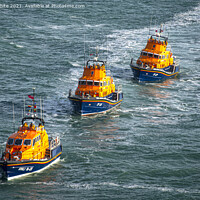 Buy canvas prints of Brave Lifeboat Crew Battling Rough Seas by kathy white