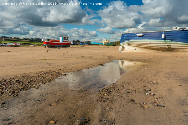 Boats Moored in Alnmouth Harbour at Low Tide Picture Board by Richard Laidler