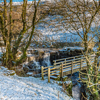 Buy canvas prints of Ettersgill Beck Waterfall and Footbridge in Snow by Richard Laidler