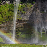 Buy canvas prints of Rainbow in front of Seljalandsfoss waterfall in Iceland by Lensw0rld 