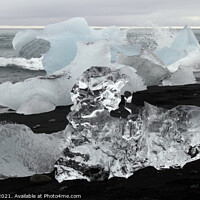 Buy canvas prints of Blocks of glacial ice washed ashore  by Lensw0rld 