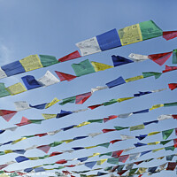 Buy canvas prints of Tibetan prayer flags against the blue sky by Lensw0rld 