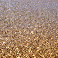 Buy canvas prints of Calm ripples on the water surface at a beach by Lensw0rld 