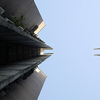 Buy canvas prints of Looking up a brutalist building in Skopje by Lensw0rld 