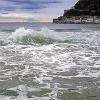 Buy canvas prints of A wave breaks in the bay of San Sebastian, Spain by Lensw0rld 