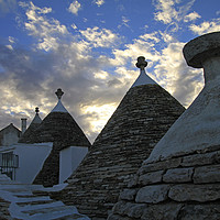 Buy canvas prints of Dramatic sky over Alberobello, Italy by Lensw0rld 