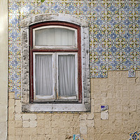 Buy canvas prints of Weathered, but beautiful wall adorned with tiles by Lensw0rld 