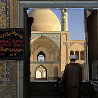 Buy canvas prints of A man enters Agha Bozorg mosque by Lensw0rld 