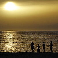 Buy canvas prints of Silhouettes of a family at the beach in Crete duri by Lensw0rld 