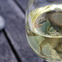 Buy canvas prints of Town reflection in a glass of white wine by Lensw0rld 