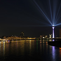 Buy canvas prints of Light show from Düsseldorf's "Rheinturm" at night by Lensw0rld 