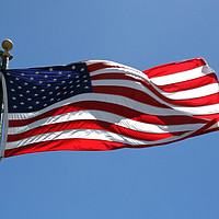 Buy canvas prints of American flag waving on a sunny day by Lensw0rld 