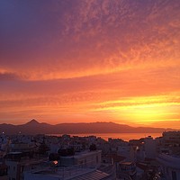 Buy canvas prints of Gorgeous sunset over the cityscape of Heraklion, C by Lensw0rld 