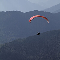 Buy canvas prints of Paraglider in front of a mountain panorama by Lensw0rld 