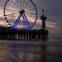 Buy canvas prints of Ferris wheel at the beach of Scheveningen, Holland by Lensw0rld 
