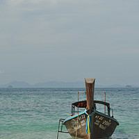 Buy canvas prints of Traditional Thai Longtail Boat on a Beach by Harshil Shah