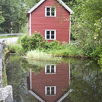 Buy canvas prints of Reflection of a little red house by Sylvain Beauregard