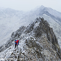 Buy canvas prints of Crib Goch winter panorama, Snowdon by Justin Foulkes