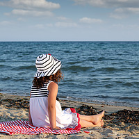Buy canvas prints of little girl sitting on beach by goce risteski