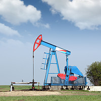 Buy canvas prints of oil pump jack on field by goce risteski