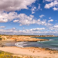 Buy canvas prints of Panoramic view from Cala Mosca by Stuart Atton