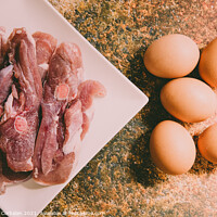 Buy canvas prints of Raw meat and eggs for cooking by Joaquin Corbalan