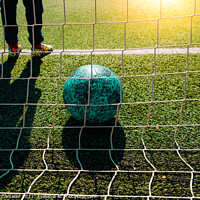 Buy canvas prints of Soccer ball entering a goal defended by a goalkeeper, copy space by Joaquin Corbalan