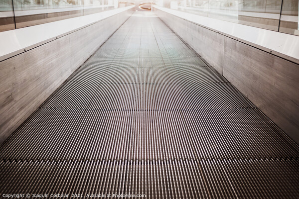 Flat escalator in a shopping mall without people, luminous unfoc Picture Board by Joaquin Corbalan
