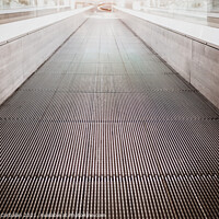 Buy canvas prints of Flat escalator in a shopping mall without people, luminous unfoc by Joaquin Corbalan