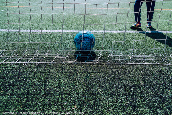 Soccer player in a goal tries to stop a ball, background with co Picture Board by Joaquin Corbalan