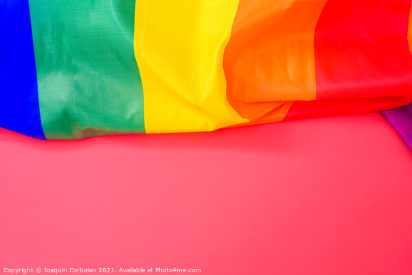 Red background with space for text, with the rainbow flag of the Picture Board by Joaquin Corbalan