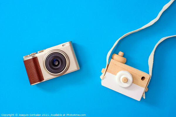 Two cameras, one modern and one old, compared one next to the ot Picture Board by Joaquin Corbalan