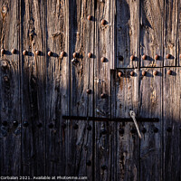 Buy canvas prints of Old and decrepit wooden gate, half lit by the sun, in an unpopul by Joaquin Corbalan