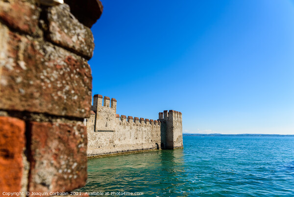 Facade of the castle of Sirmione surrounded by water. Picture Board by Joaquin Corbalan