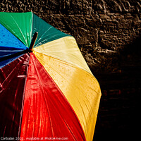 Buy canvas prints of Open umbrella against the intense sun with bright colors and dar by Joaquin Corbalan