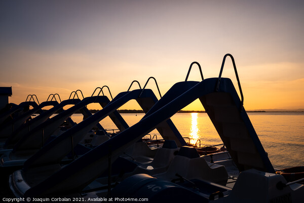 Silhouette of water scooters parked on the shore at the end of t Picture Board by Joaquin Corbalan