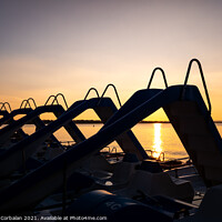 Buy canvas prints of Silhouette of water scooters parked on the shore at the end of t by Joaquin Corbalan