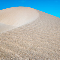 Buy canvas prints of Fine sand blown by the wind creates dunes on the shores of the sea. by Joaquin Corbalan