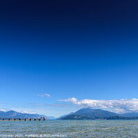 Buy canvas prints of Calm water lake in Garda, Italy with a wooden walkway on a sunny by Joaquin Corbalan