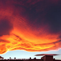 Buy canvas prints of A large cloud with curious wavy shapes and warm reddish colors d by Joaquin Corbalan