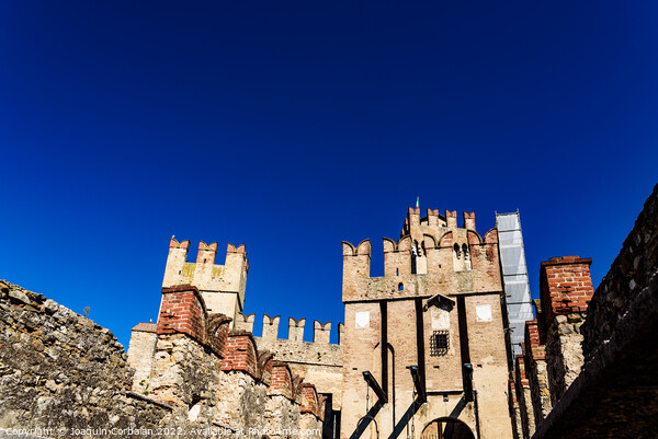 Facade of the castle of Sirmione surrounded by water. Picture Board by Joaquin Corbalan